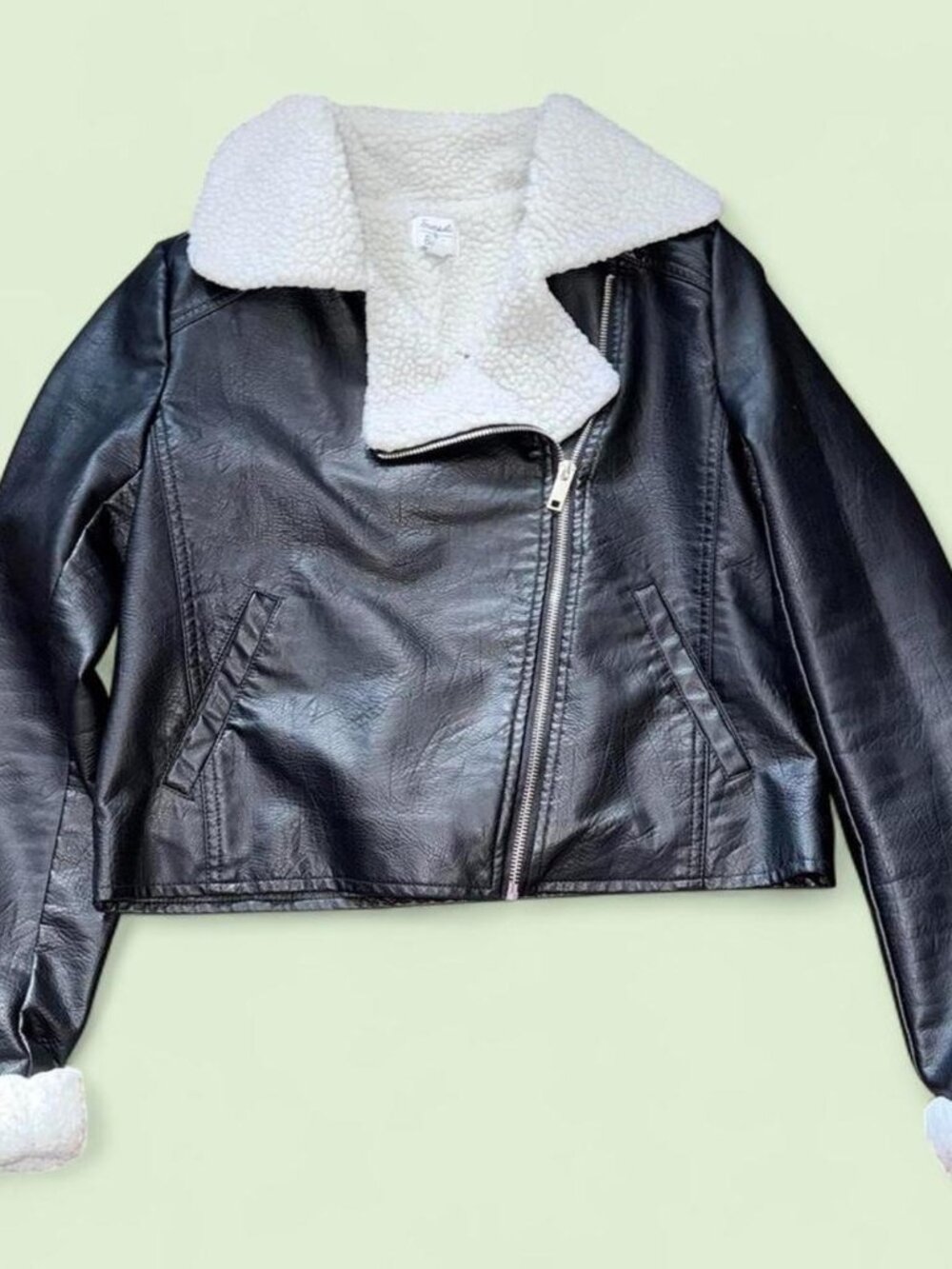 Black faux leather moto jacket with cozy white sherpa lining